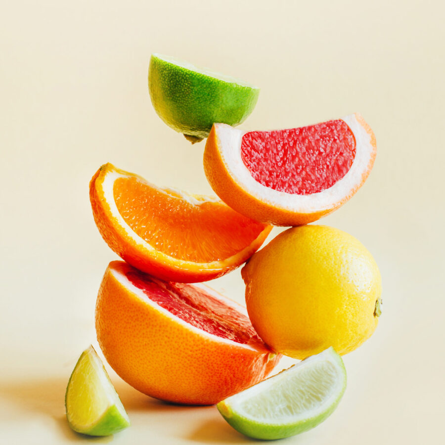 Pyramid,Of,Citrus,Fruits,Grapefruit,,Orange,,Lemon,,Lime,On,Yellow