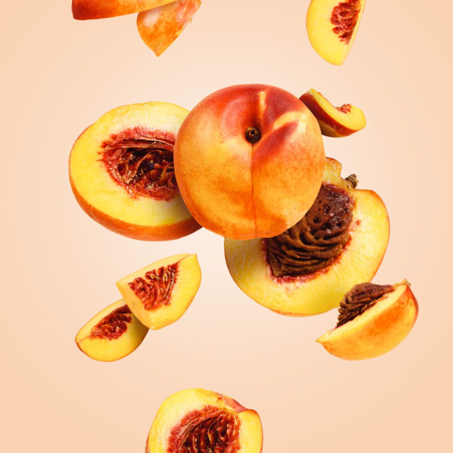 Slices,Of,Ripe,And,Juicy,Peaches,In,The,Motion,,Flying
